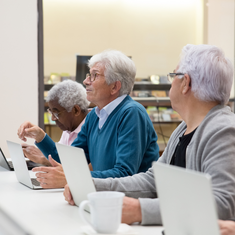 Computer Literacy several senior citizens using laptops