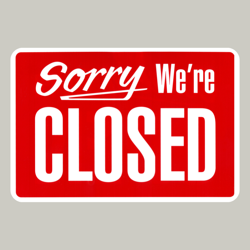 Sorry we are closed text on red colored sign with white edging on gray background